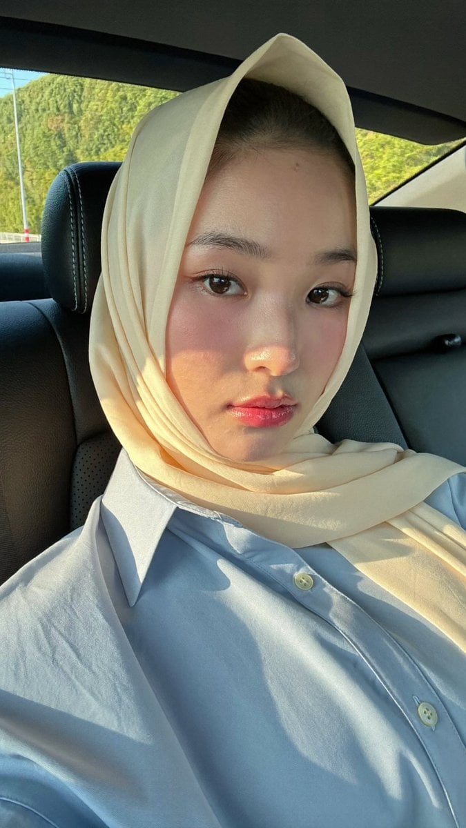 Portrait of Woman in Car with Hijab