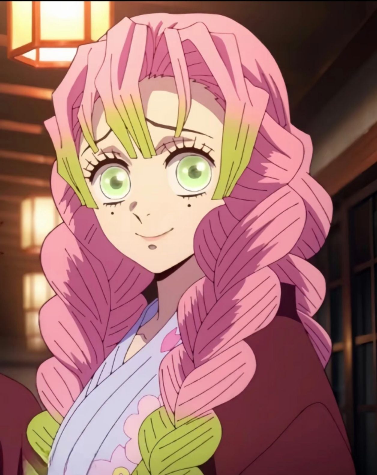 Anime character Mitsuri Kanroji with pink and green braids smiling