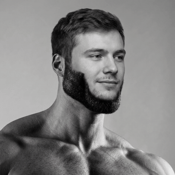 Muscular man with a sharp jawline and thick beard