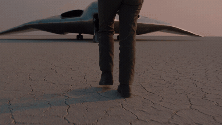 Eight-second Seedance 2.5 text-to-video clip made in ChatGPT: a test pilot walks across a salt flat at dawn toward a silver spacecraft with its ramp lowered