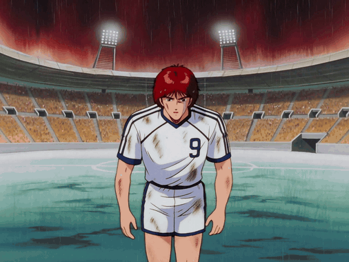 Red-haired anime soccer player standing in a dirty uniform inside a stadium