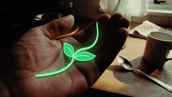 Animated glowing green sprout growing in an open hand