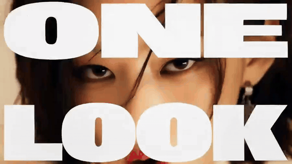 Close-up of a woman's eyes behind bold white text ONE LOOK