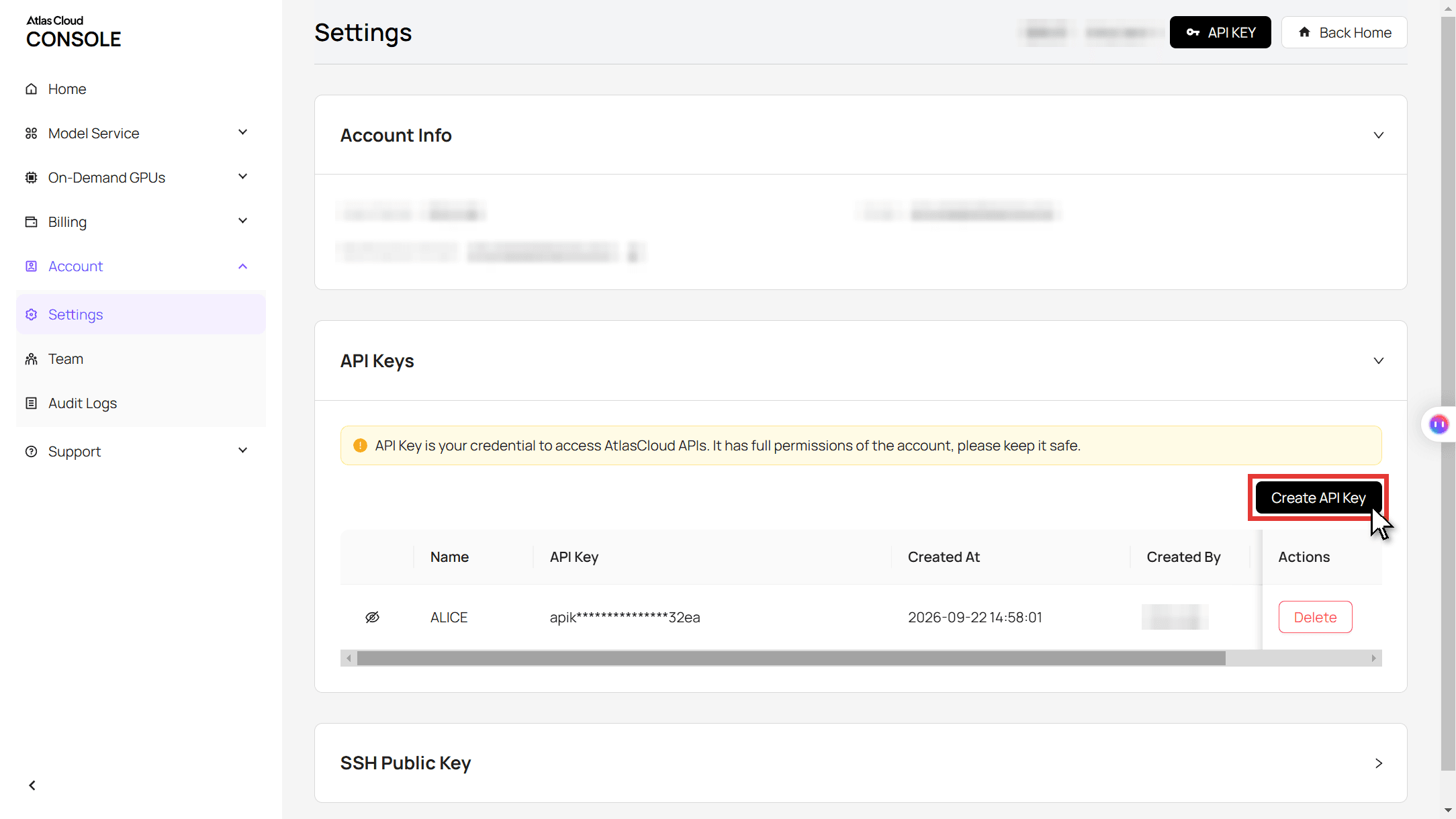 The Atlas Cloud console Settings page showing the API Keys panel, a red box and cursor on the Create API Key button, and one existing key with its value masked.
