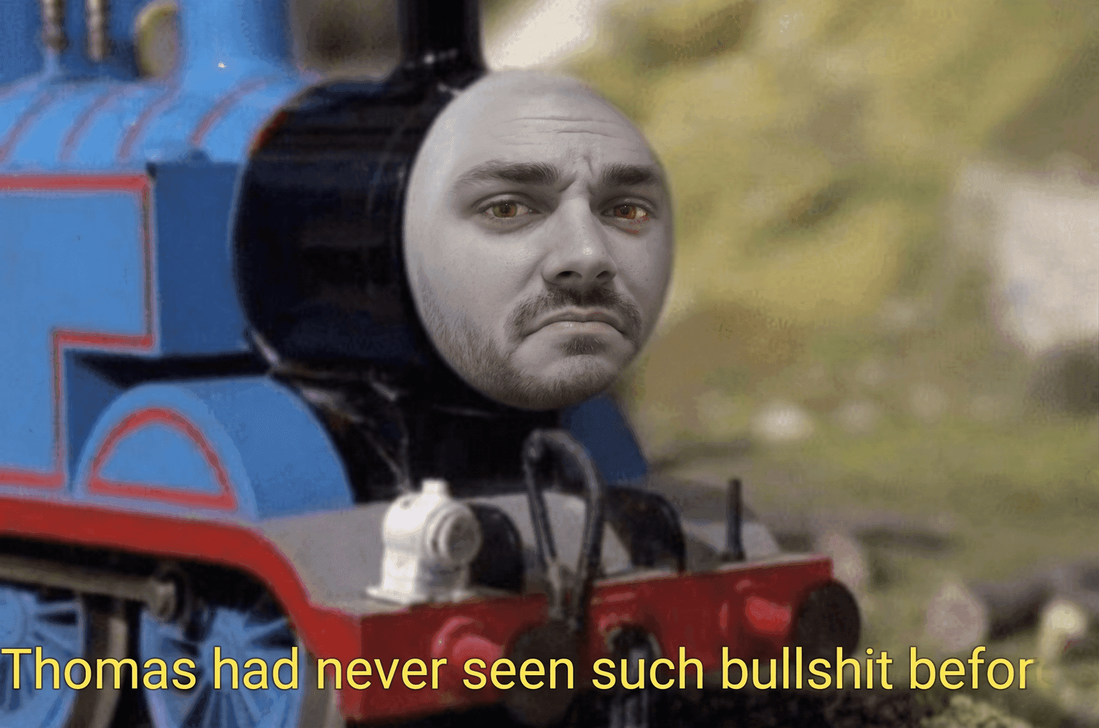 Thomas the Tank Engine with an annoyed man's face and caption